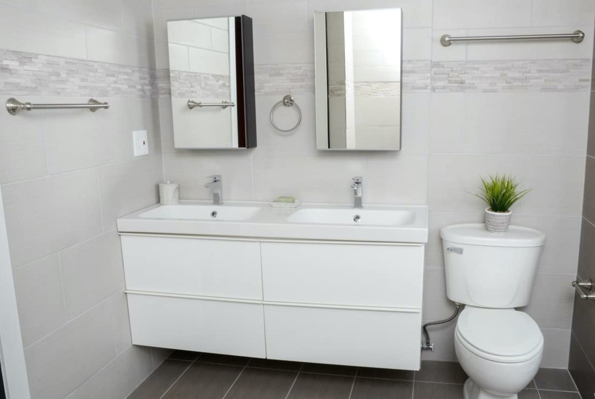 white bathroom with nickel towel bar set